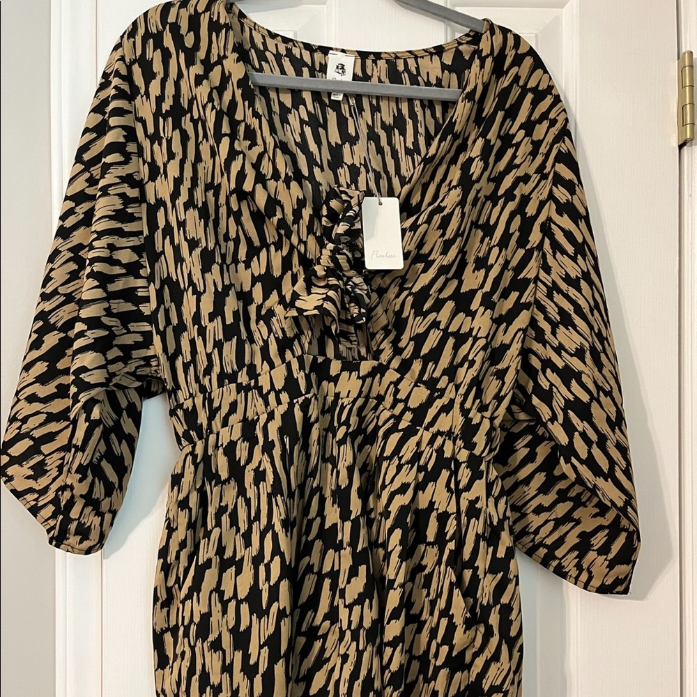 Brand: VICI, adorable printed romper. Ties in the front with a little cut out